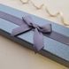 Коробочка для браслета или цепочки серого цвета с бантиком