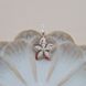Подвеска из серебра с золотом Цветок с пятью лепестками и цирконами разного размера